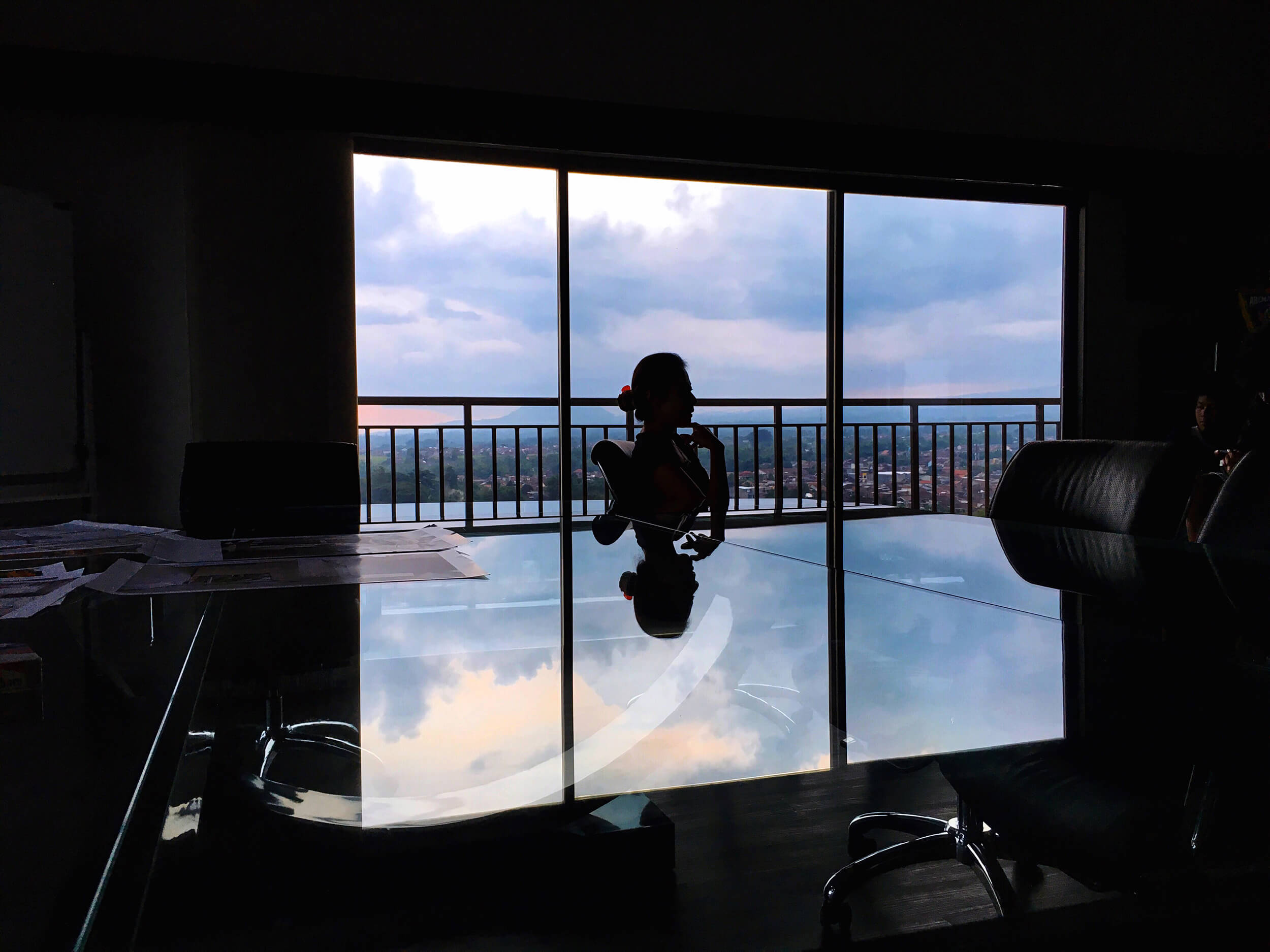 Conference participant raising their hand to speak, close-up shot